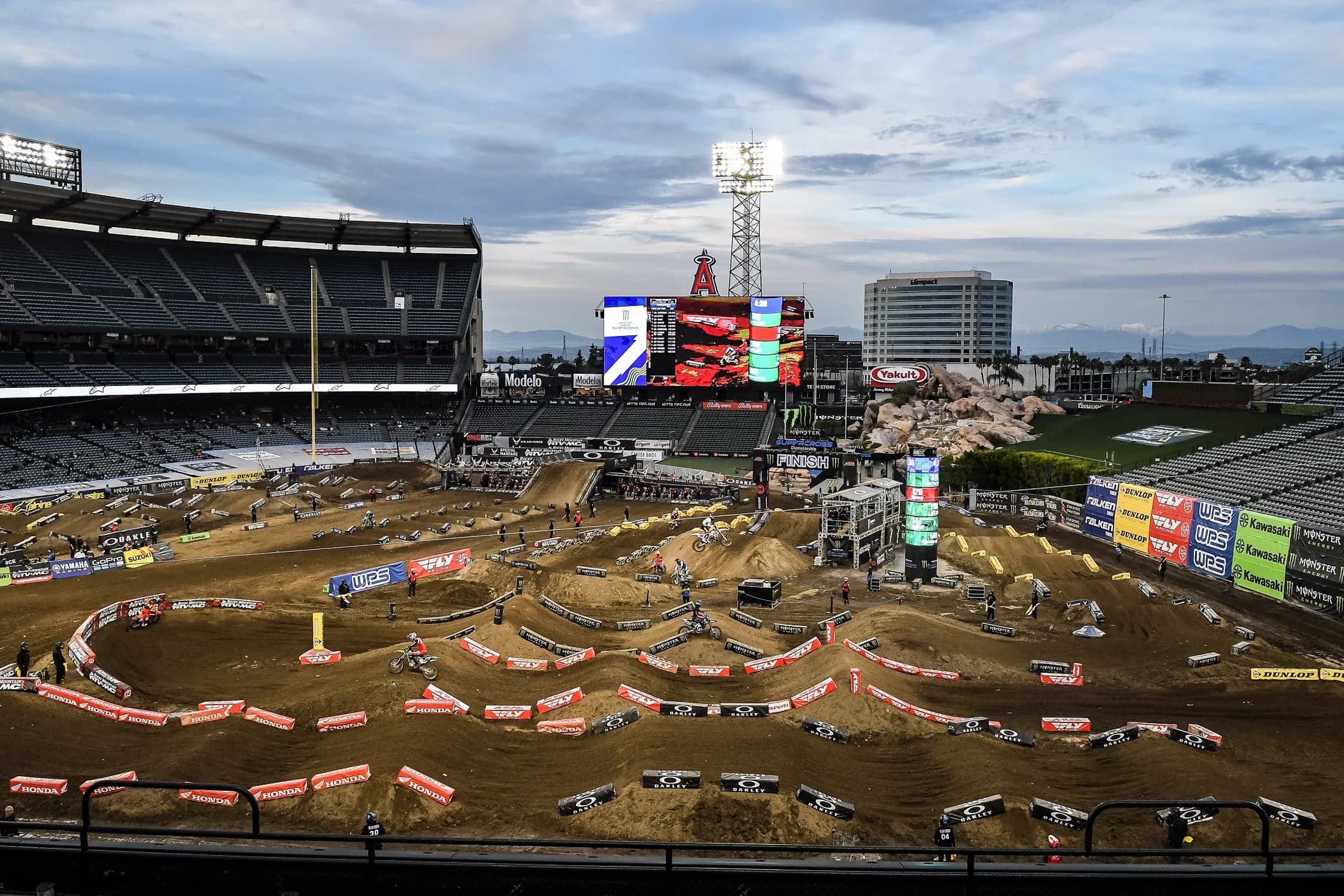 Riders battling the whoops under the lights at Angel Stadium Supercross